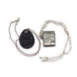 A silver vesta and a mourning pendant on chain