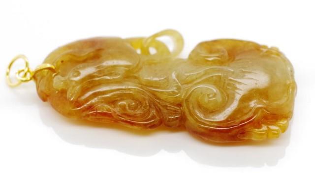 Oriental carved yellow jade pendant