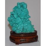 Chinese turquoise coloured figures group on stand