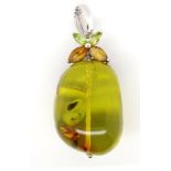 Green Baltic amber and 9ct white gold pendant