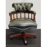 Leather upholstered captain's chair