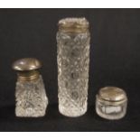 Three assorted silver topped jars