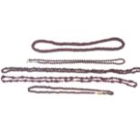 A group of five garnet beaded necklaces