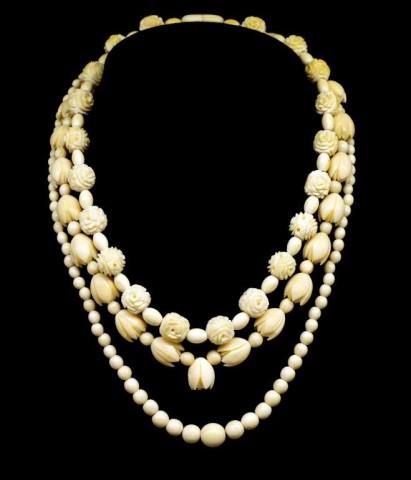 A group of three carved ivory beaded necklaces