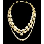 A group of three carved ivory beaded necklaces