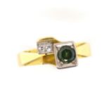 18ct yellow gold diamond and green stone ring