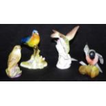 Four various hand painted bird figures