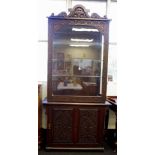 Antique Eastern elevated display cabinet