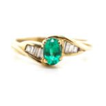 Emerald and diamond set 9ct yellow gold ring