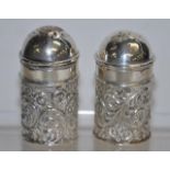 Pair of sterling silver pepper casters