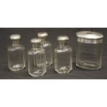 Set five Edward VII silver capped toilet bottles