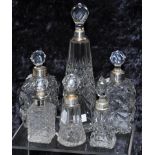 Six scent bottles with sterling silver collars