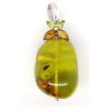 Green Baltic amber and 9ct white gold pendant