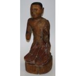 Vintage Eastern carved wood Buddhist figure