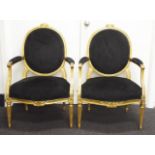 Two French Louis XVI style gilt wood armchairs