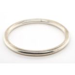 A solid sterling silver bangle,