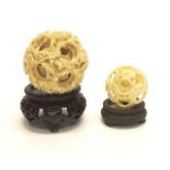 Two vintage Chinese carved ivory puzzle balls