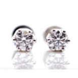 Two 0.30ct diamond stud earrings with GIA