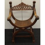 Early 20th century oak X frame arm chair