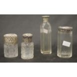 Three sterling silver topped toiletry bottles