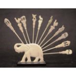 Carved ivory elephant figure with toothpicks