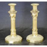 Pair of ornate column brass candlesticks