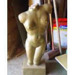 Gold painted nude figure