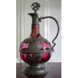 Art Nouveau pewter and ruby glass claret jug