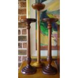 Three timber hat stands
