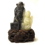 Chinese carved blue & white jade figure & stand