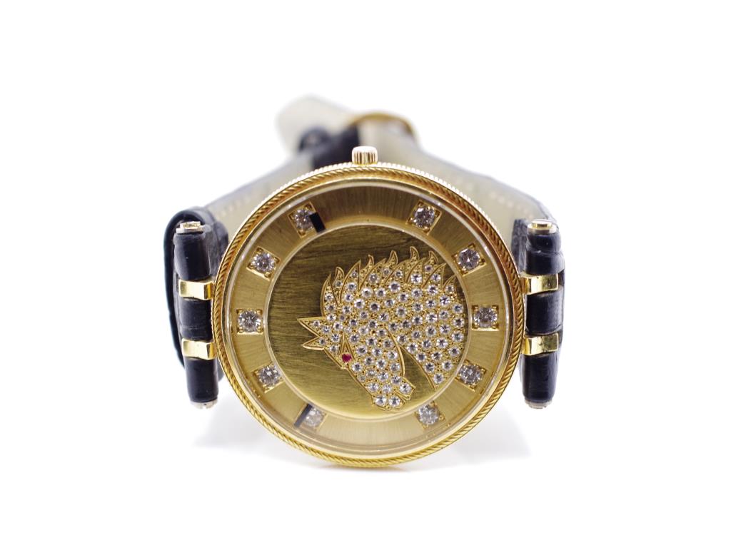 Diamond and ruby set 18ct yellow gold watch