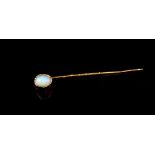 Solid white opal and gold stick pin