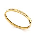 Half ct diamonds and 9ct yellow gold bangle