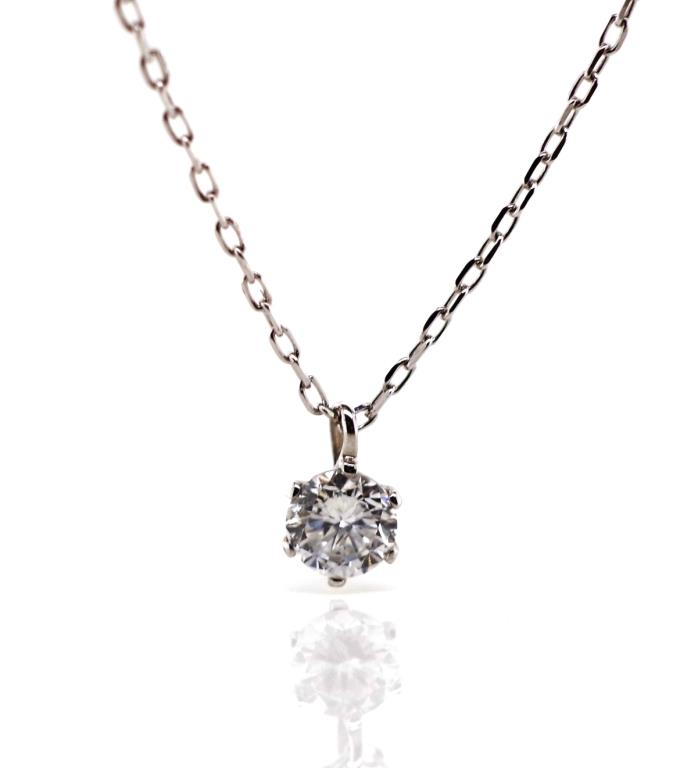 A child's diamond and 18ct white gold pendant