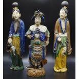 Three Chinese stoneware Sancai attendant figures