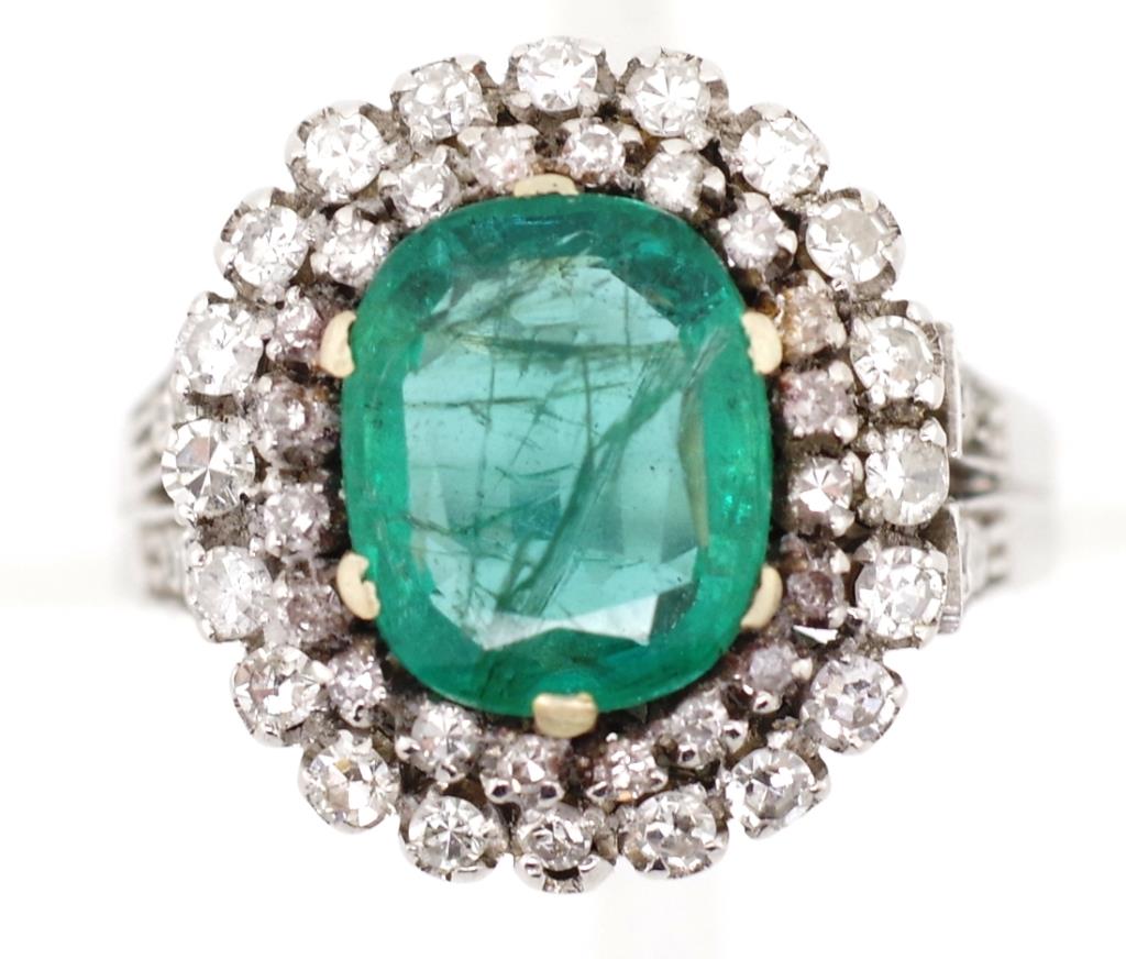 Emerald and diamond double halo ring