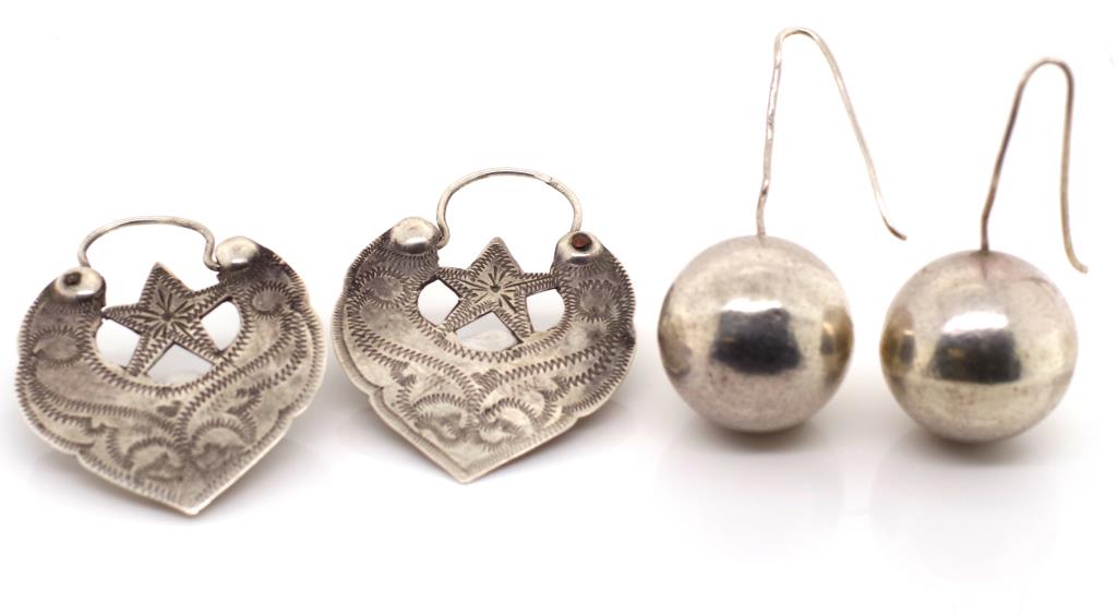 Two pairs of Central Asian silver earrings