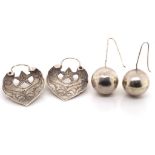 Two pairs of Central Asian silver earrings