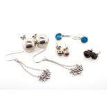Five pairs of silver earrings