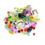 A box of assorted coloured gemstones