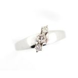 Three stone diamond set 18ct white gold ring.