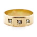 Three stone diamond and 9ct yellow gold ring