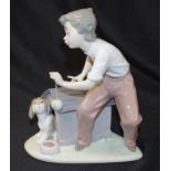 Lladro boy with dog figure