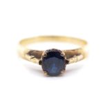 Blue gemstone and gold ring