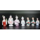 Seven small antique half dolls
