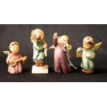 Four various Goebel Hummel figures