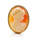 A well carved cameo and 9ct yellow gold brooch