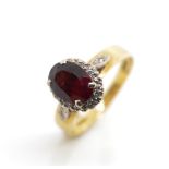 Garnet and diamond 18ct yellow gold ring