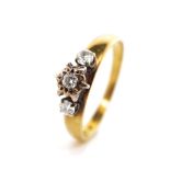 Three stone diamond 18ct gold ring