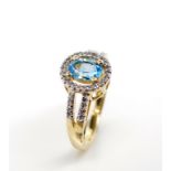 Topaz and diamond set 14ct yellow gold halo ring